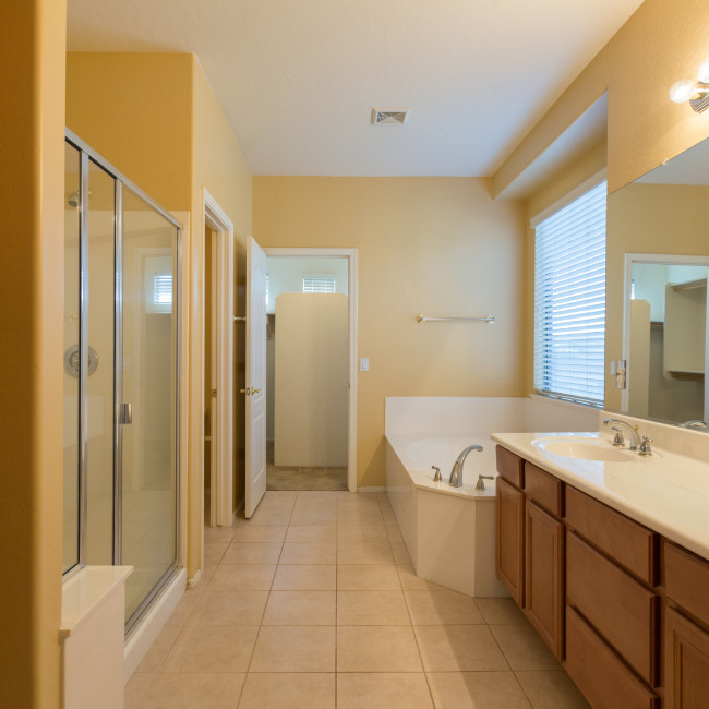 Long narrow master bathroom with master closet at end