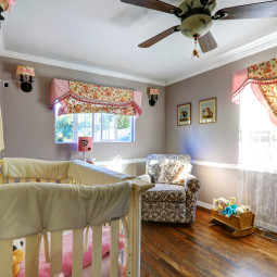 Nurshery room interion with floral curtains