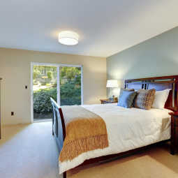 Green beautiful bedroom with classic furniture