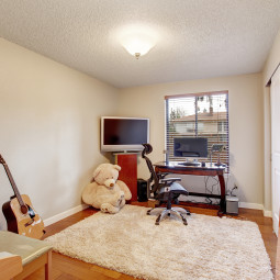 Large office room with hardwood floor.